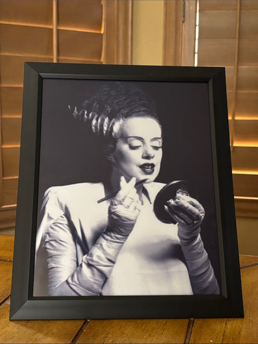 8x10” Bride of Frankenstein putting on lipstick Black Framed Portrait Wall Art